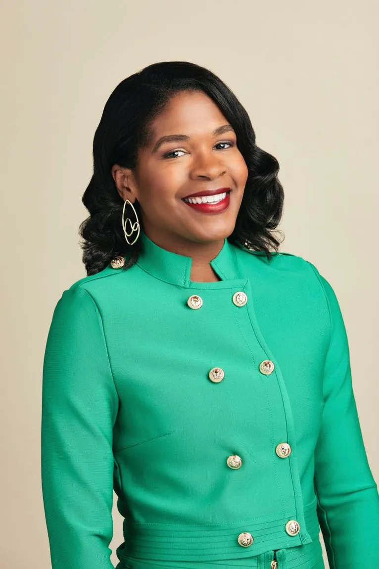 Heather Dowdy, founder of The Accessibility Catalyst Group, in a green jacket